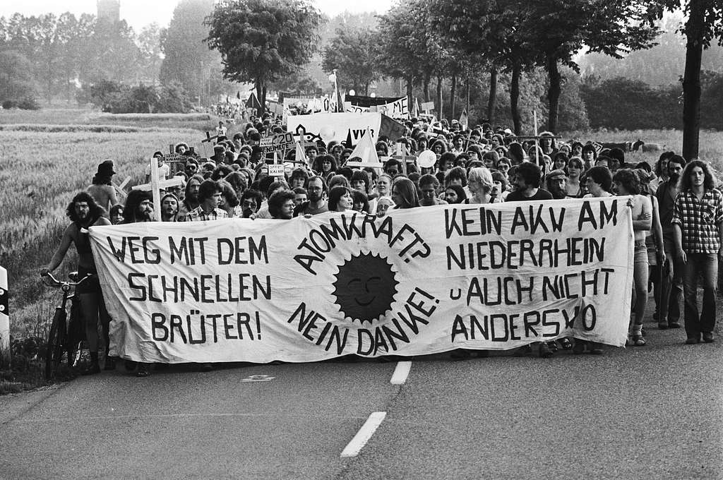 Anti nuclear protestors holding banner in German